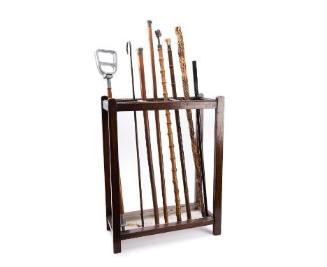 A group of eight various walking sticks, 19th and 20th century; including two horse measuring sticks -one with antler handle,