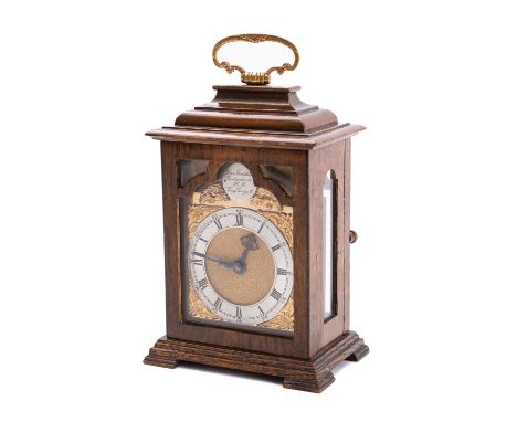 Charles Frodsham, London a small mahogany mantel clock having an eight-day duration timepiece movement, the break-arch brass 