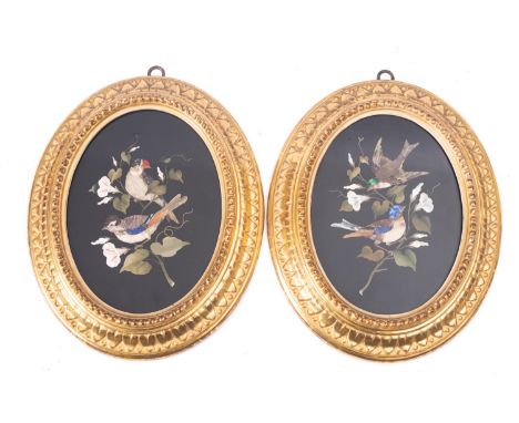 A pair of Italian oval pietre dure panels depicting birds, circa 1900, with gilt moulding frames; 29cm high overall