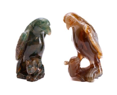 An Oriental agate carving and one similar both in the form of a hawk with one claw resting on a rabbit, 9.5 and 8.5cm [the fi