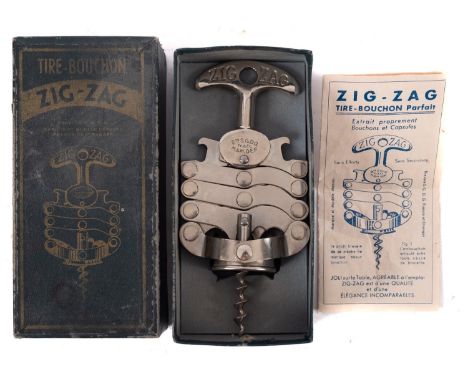 A French polished steel zig-zag corkscrew, inscribed 'Bte SGDG Fr & Et M & M Dep, with original label and box.Provenance:  Th