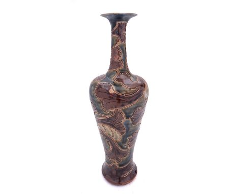 A Royal Doulton stoneware vase of slender baluster form incised with stylised foliage and inscribed E. Cleeve under green and