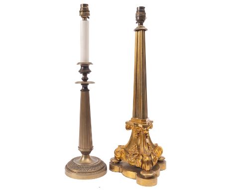A gilt metal table lamp in Regency style, 19th century and later fitted for electricity; the electrical fitment on a reeded, 