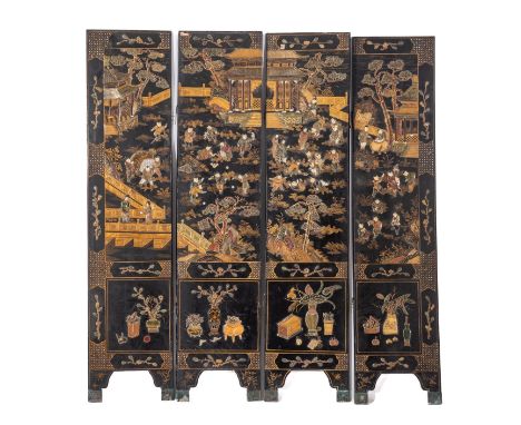 A Chinese parcel gilt lacquered and carved bone and soapstone mounted four fold screen, late 19th century; the rectangular le