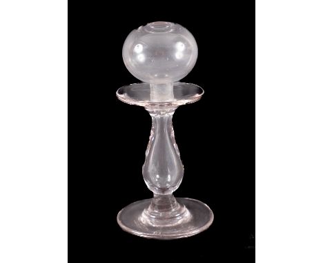 A lace maker's glass lamp, with plain baluster stem and circular base.Provenance:  The Christopher Hawkings Collection of Cur