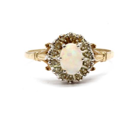 A 9ct gold opal and diamond cluster ring,with an oval cabochon opal to surround of eight cut diamonds, with fleur-de-lys shou