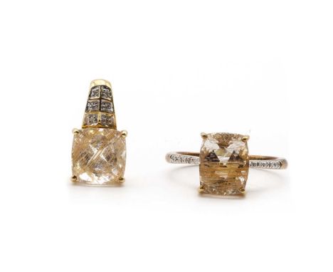 A 9ct gold rutilated quartz and diamond ring,with a cushion cut rutilated quartz, to shoulders grain set with graduated eight