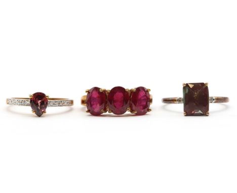 Three 9ct gold rings, comprising a three stone fracture filled ruby ring, a zircon and diamond ring, and an andesine and diam