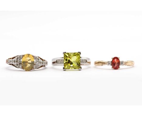 Three 9ct gold rings,comprising a white gold lemon quartz and diamond ring, a faceted yellow fire opal and diamond ring, and 