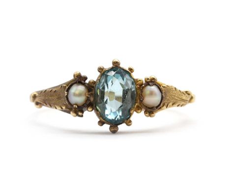 A gold blue zircon and split pearl ring, with a later replacement oval mixed cut blue zircon, with a split pearl at each side