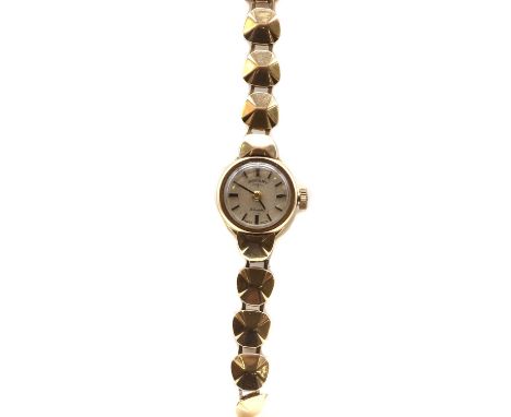 A ladies' 9ct gold Rotary mechanical bracelet watch,with a silvered dial and baton hour markers, to integral bracelet and lad