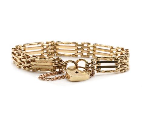 A 9ct gold gate bracelet,with plain inner bars and crimped outer bars, to heart shaped padlock clasp and safety chain, London