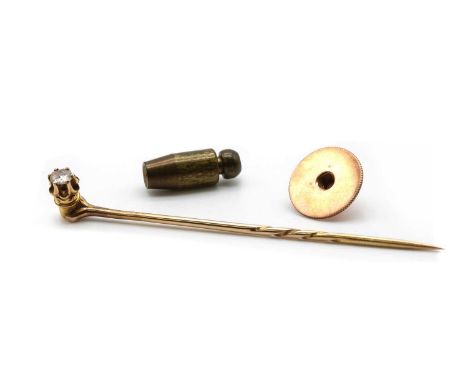 A cased single stone diamond stick pin,an old European cut diamond, claw set, to interchangeable pin and collar stud fitting,