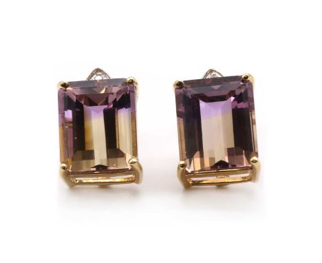 A pair of 9ct gold ametrine and diamond stud earrings,with an emerald cut ametrine, approximately 11 x 9mm, surmounted by a b