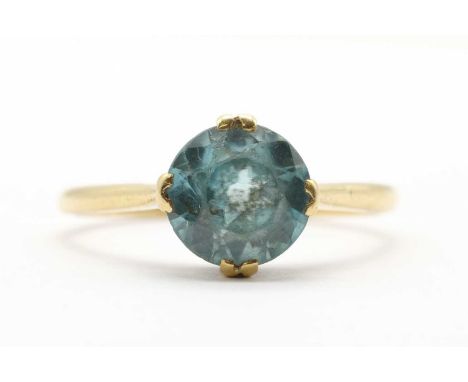 A gold single stone blue zircon ring, the blue zircon approximately 8mm, claw set to tapered shoulders and a 'D' section shan