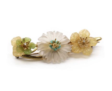 A gold carved gemstone flower and diamond brooch, with a central carved rock crystal and turquoise flower, with green and yel