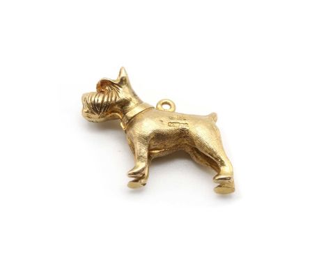 A 9ct gold dog charm, probably a miniature schnauzer, with synthetic ruby set eyes, London 1963, 5.94gMinor surface marks/scr