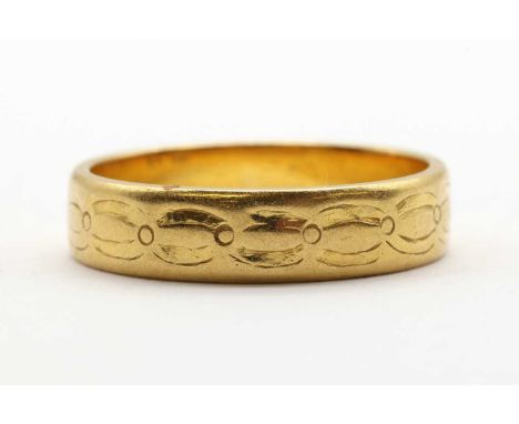 A gold flat section patterned wedding ring, marked 22k, tested as approximately 22ct gold, 4.88g.Finger size NVery slightly o