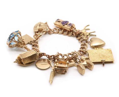 A gold charm bracelet, a 9ct gold double curb link bracelet with heart shaped padlock clasp, suspending eleven charms, to inc