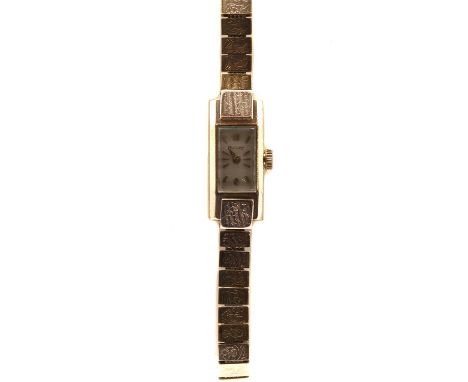 A ladies' 9ct gold Rotary mechanical bracelet watch, a rectangular case with silvered dial and baton hour markers, to link br