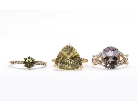 Three 9ct gold rings, comprising a yellow beryl and diamond ring, a citrine and diamond ring, and an amethyst and diamond rin