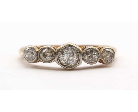 A gold five stone diamond ring, with a row of graduated old European cut diamonds, to tapered shoulders and a plain shank, te