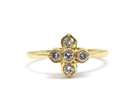 An 18ct gold diamond floral cluster ring, with a central rub set brilliant cut diamond, to surround of brilliant cut diamonds