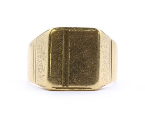 An 18ct gold signet ring, with a rectangular head to tapered shoulders and a flat section shank, London 1972, 13.31g.Finger s