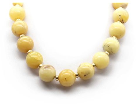 A potch opal and gold bead necklace, with spherical yellow potch opal beads, some with dendritic inclusions, 13.5 to 20mm in 