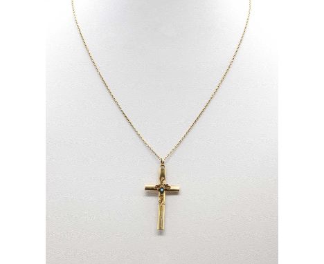 A Continental gold hollow cross pendant, with trailing vine decoration, suspended on a filed trace link chain with bolt ring 