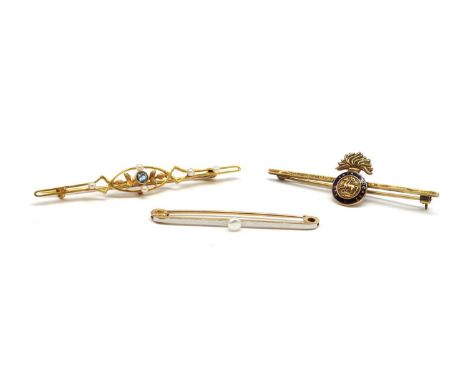 Three gold brooches, comprising an Edwardian gold aquamarine and seed pearl brooch, with pin and 'C' catch, marked 15ct, test