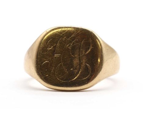 A 9ct gold signet ring, a cushion shaped head with engraved initials, to tapered shoulders and a plain shank, hallmark worn, 