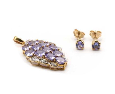 A 9ct gold tanzanite and diamond pendant, Birmingham,together with a pair of 9ct gold single stone tanzanite stud earrings,Bi