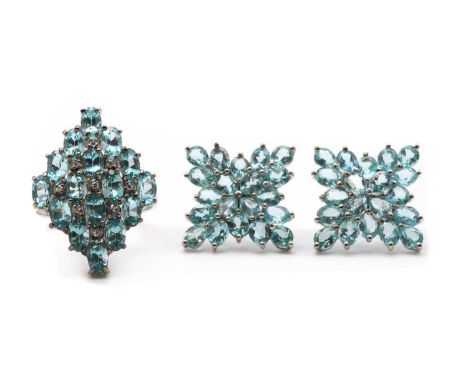 A 9ct white gold apatite and diamond ring,a lozenge shaped cluster claw set with oval mixed cut apatites and eight cut diamon