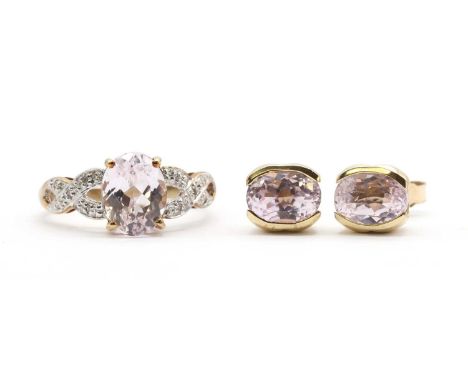 A pair of gold single stone kunzite earrings,an oval mixed cut kunzite, approximately 8 x 6mm, semi-rub set to post and butte