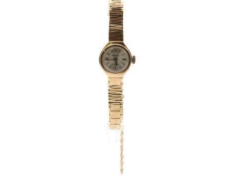 A ladies' 9ct gold Accurist mechanical bracelet watch, with a silvered dial and baton hour markers, to integral bracelet and 