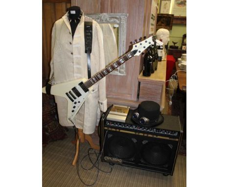 AN INSTANT 'ROCK GOD/ GODDESS' KIT comprising white finished flying V Guitar by 'Gould' with a studded strap, dog collar, ant