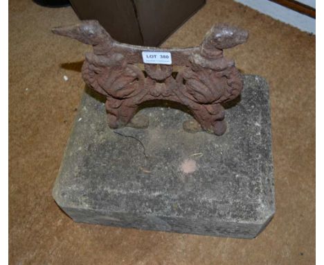 A VINTAGE CAST IRON BOOT SCRAPER in the form of two standing greyhounds / whippets, currently mounted on a canted Cotswold st