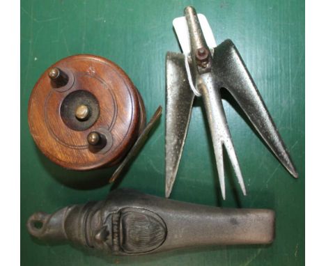 A CHROMED CAR MASCOT together with a small wooden fishing reel and a cast metal nutcracker 