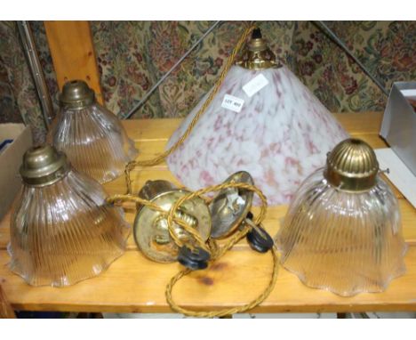 THREE GLASS HOLOPHANE SHADES together with a pink mottled glass shaded Victorian design rise-and-fall lamp, by Christopher Wr