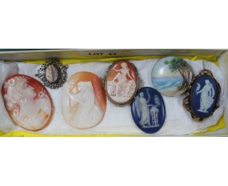 A BOX CONTAINING SIX CAMEOS and a small hand painted seascape, on a porcelain roundel 