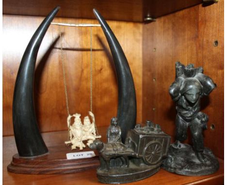 A PROBABLE FRENCH CAST METAL VESSEL in the form of a faggot gatherer, together with another metal model of a milk wagon, and 