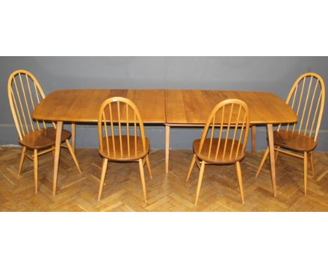 An Ercol extending dining table, the rectangular top with folding insert leaf, raised on splayed supports, 71 x 83 x 222cm ( 