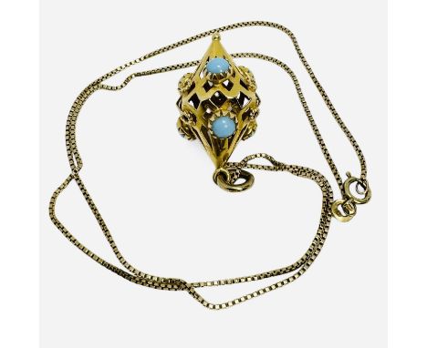A faux turquoise set Archaeological revival style lantern pendant. The piece is unmarked but tests as 18ct gold and comes wit