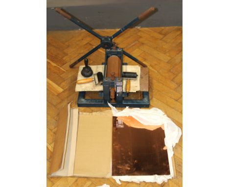 A mid 20th century bench mounting etching press, together with six 41 x 30cm copper sheets and a small quantity of tools