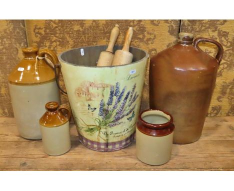 A vintage salt glazed flagon, two further smaller flagons, jar, two rolling pins, and a pale with paper finish