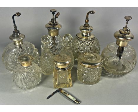 Four cut glass perfume atomisers with silver caps, together with a selection of dressing table glass jars, and a pair Wedgwoo