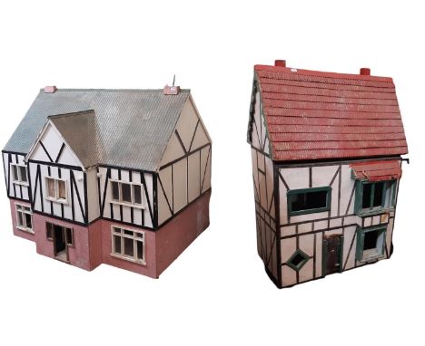 Two large unfurnished vintage Dolls houses for restoration comprising a substantial house of brick and half timbered effect o