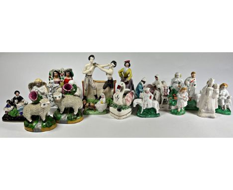 A collection of Staffordshire figure groups to include two arbour examples, an example of two men boxing, further miniature e