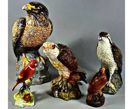 A Royal Doulton matt glazed Osprey, a Beswick Osprey decanter and a Mack Hawk, a Doulton Canary and a Beswick Eagle decanter 